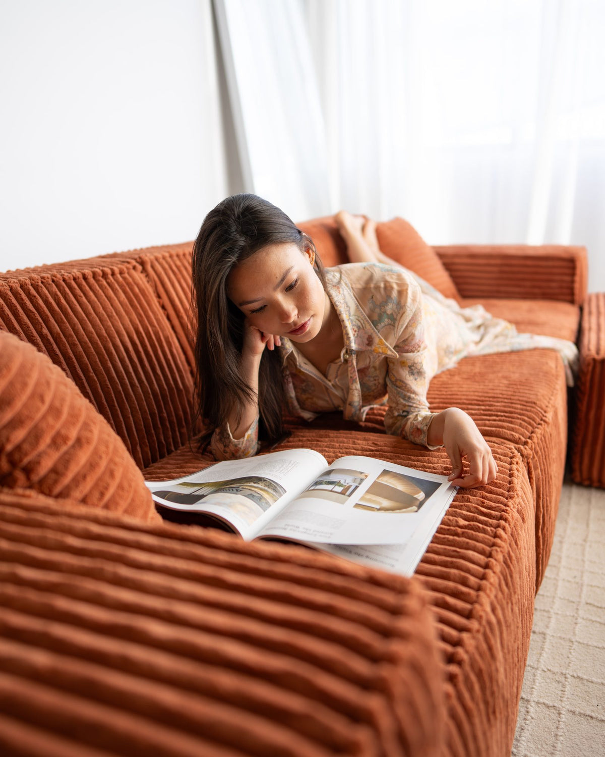 Woman on the rust corduroy Domino